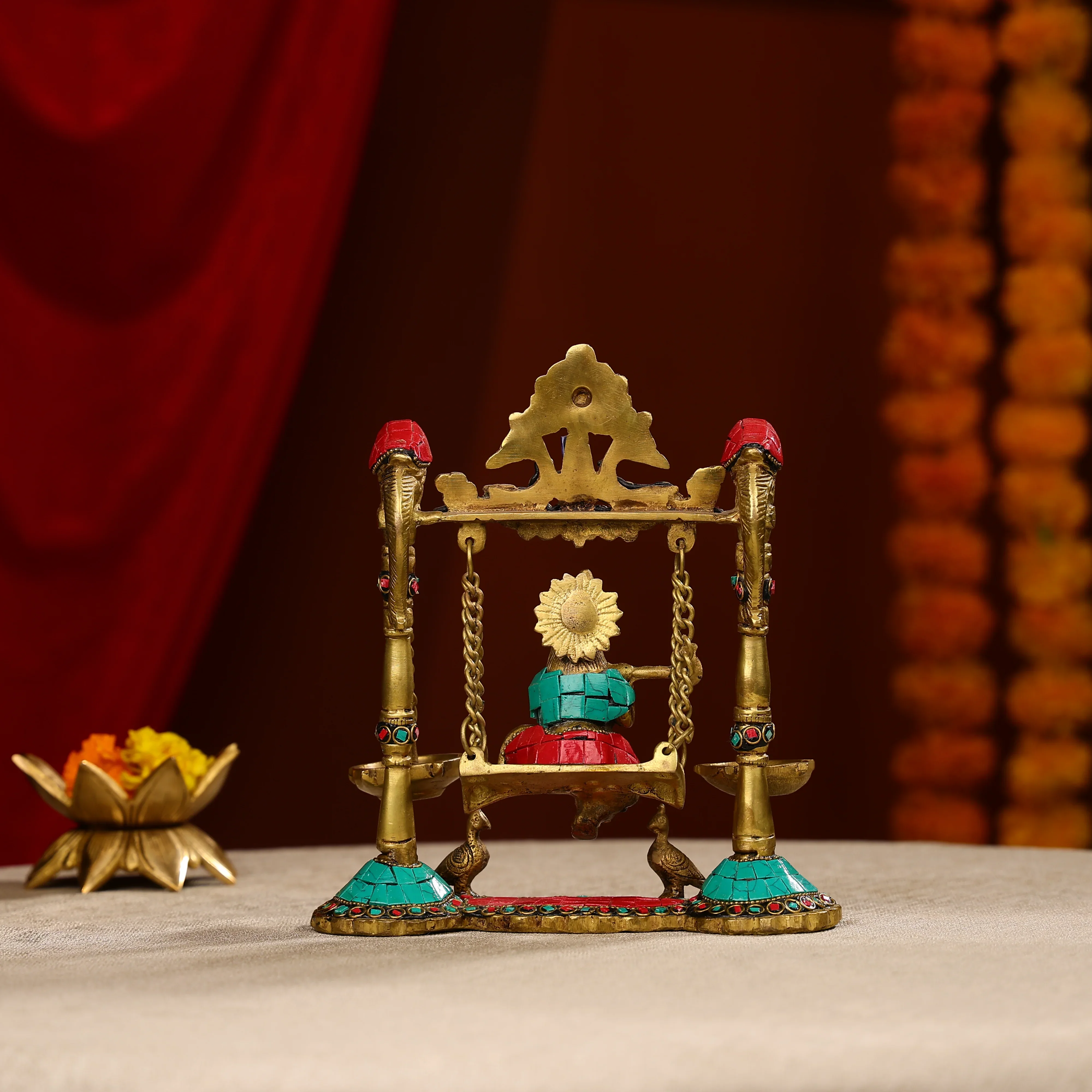 9" Brass Lord Krishna Fluting Idol on Swings With Hanging Panch Diya on Both Sides With Seated Peacocks | Stone Work - Image 4