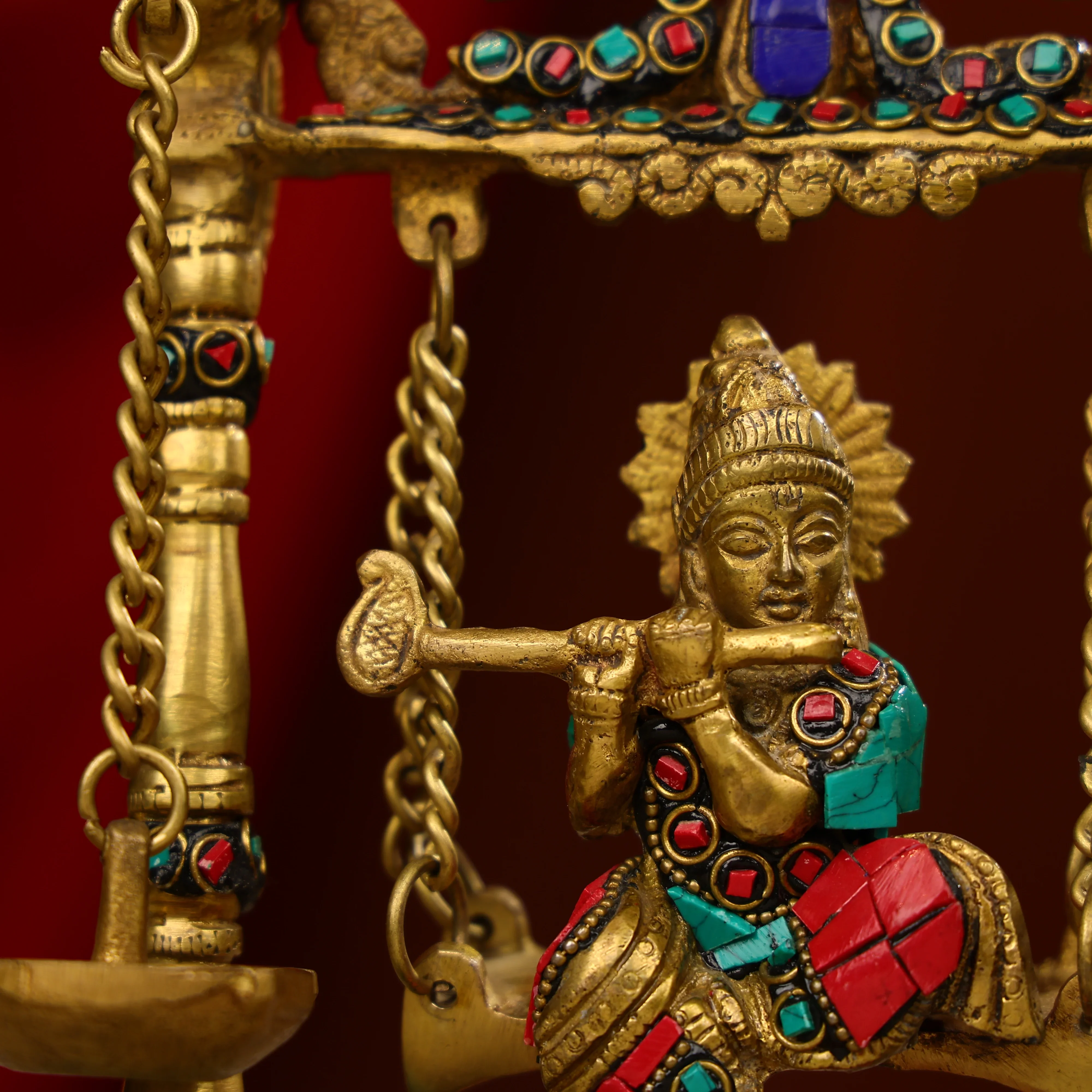 9" Brass Lord Krishna Fluting Idol on Swings With Hanging Panch Diya on Both Sides With Seated Peacocks | Stone Work - Image 5
