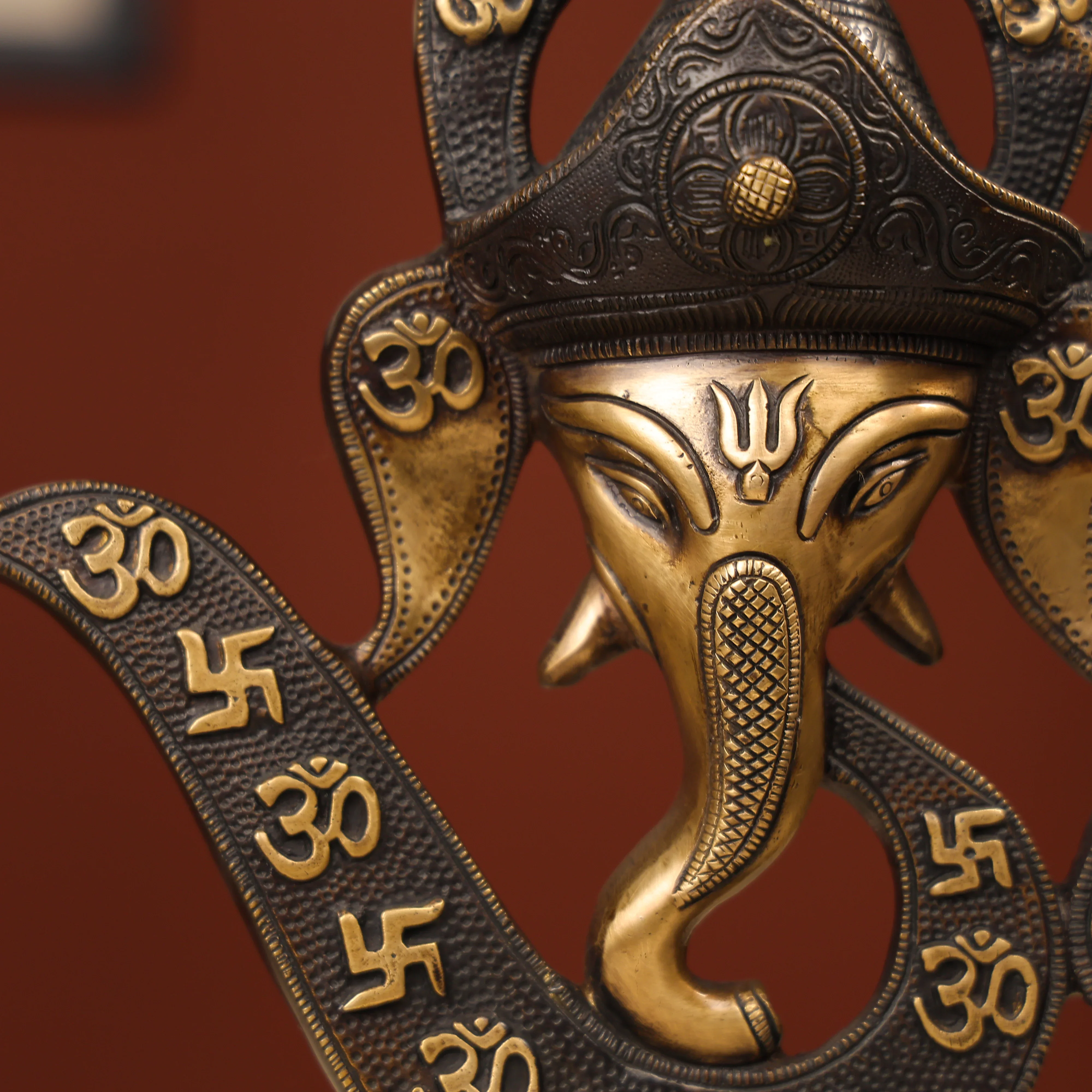 Two-Toned Brass Ganesh Head With Symbolic Swastika - Image 8